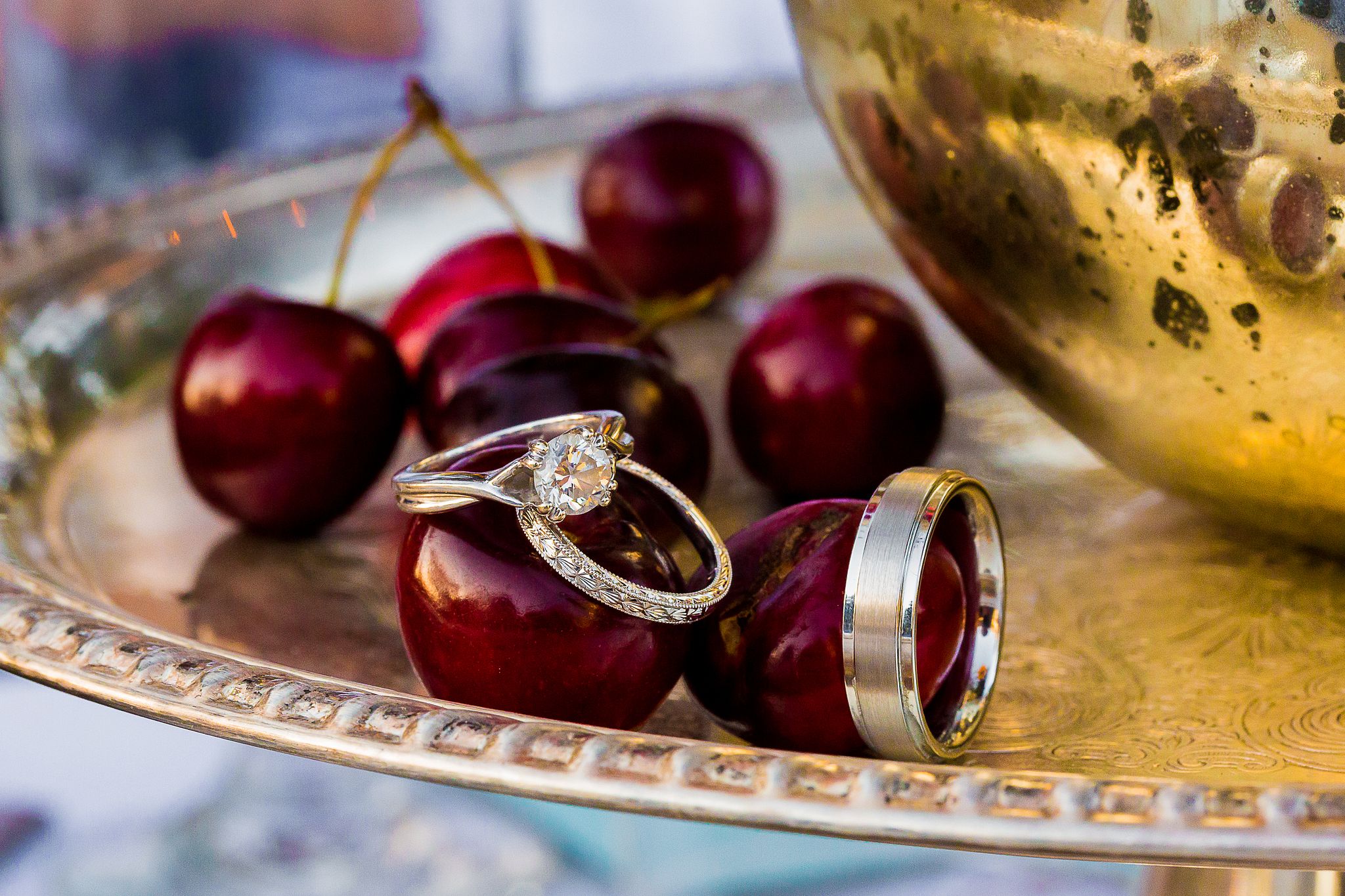 reative wedding ring detail featuring cherries at Vizcaya Sacramento in Sacramento, California