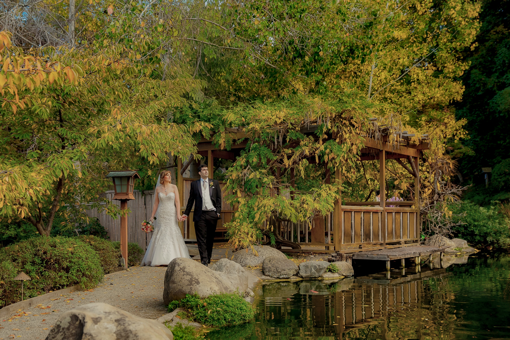 bride and groom sharing a romantic stroll at Hakone Estate and Gardens in Saratoga, California