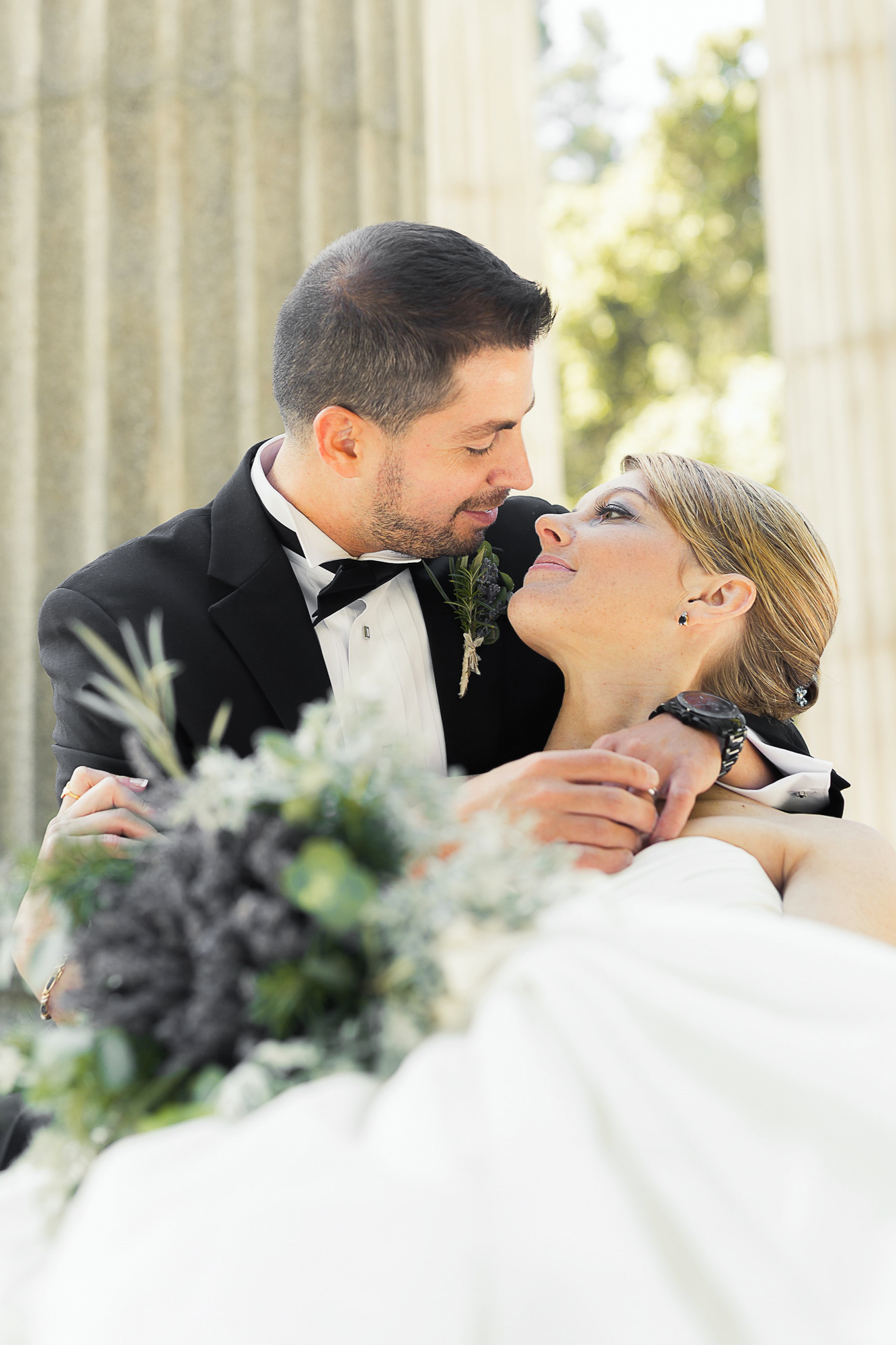 Bride and groom embracing at Pulgas Water Temple wedding venue in Redwood City California