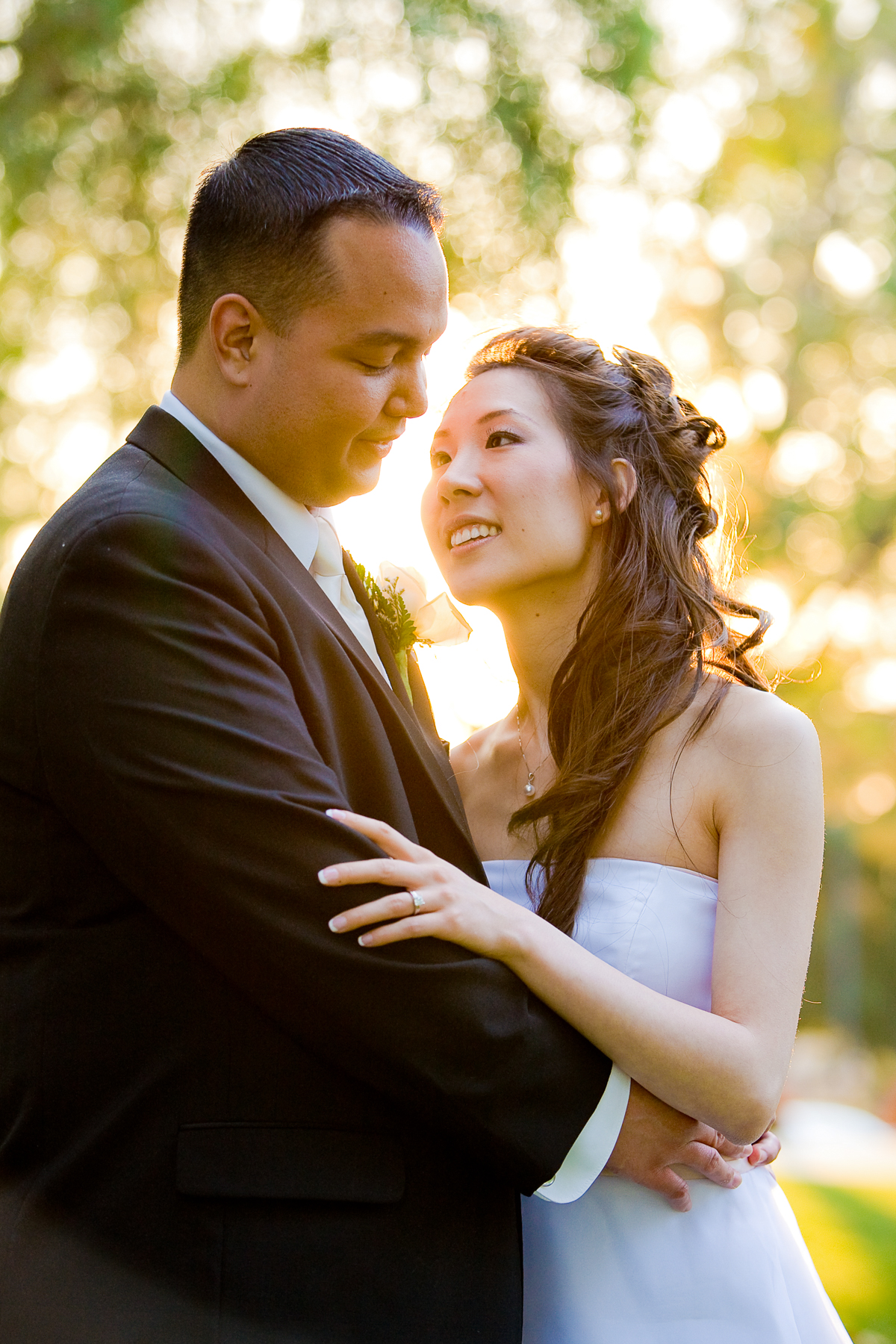 Bride gazing lovingly at groom during sunset wedding portrait at Nestldown Los Gatos CA bay area wedding photographer