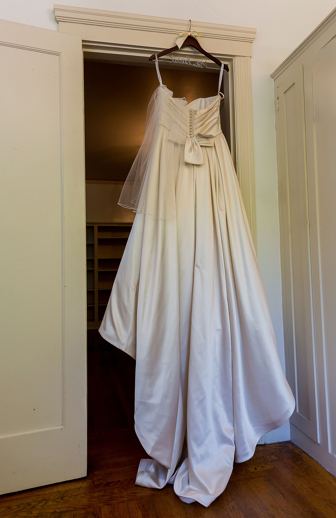 Wedding dress hanging in a suite at Palace Hotel San Francisco, capturing an elegant bridal detail before the ceremony