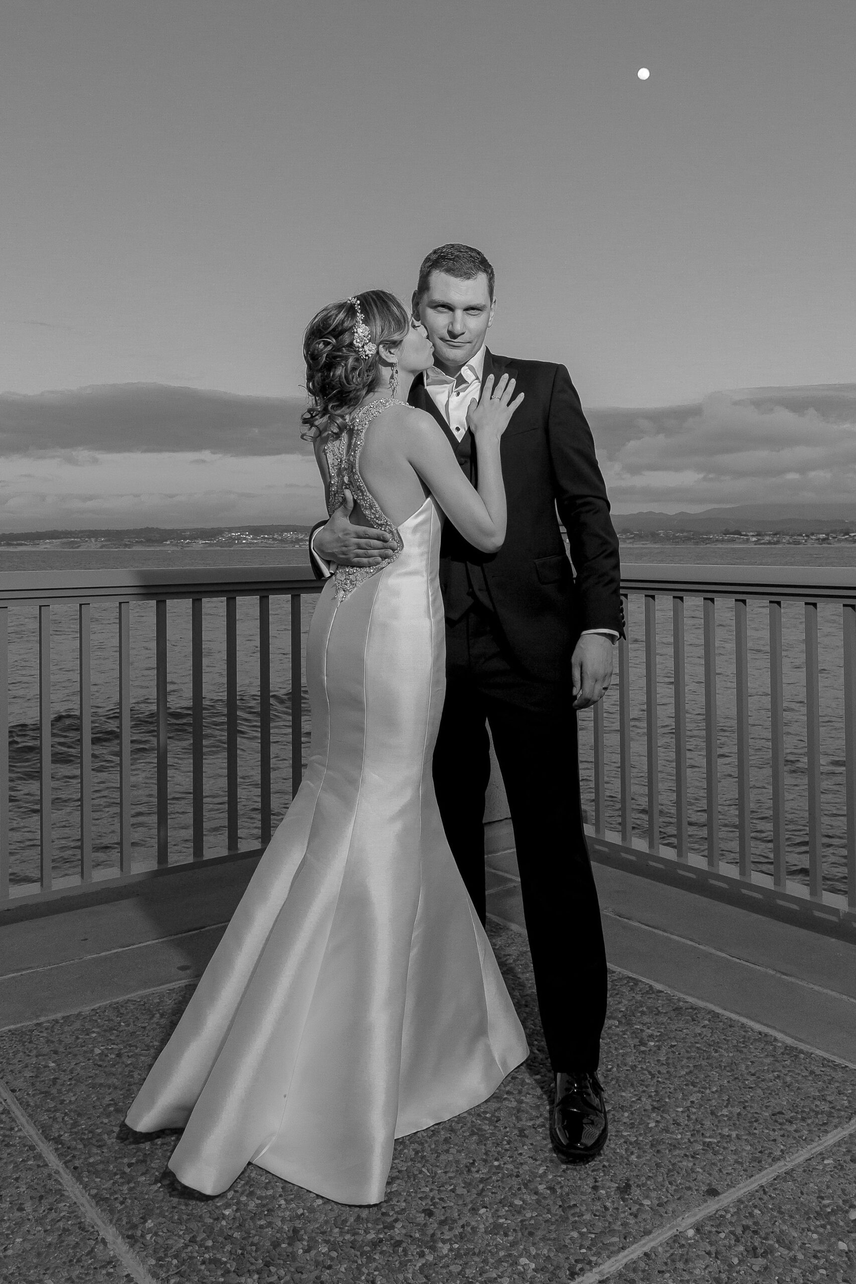 bride and groom sharing a romantic sunset moment at Monterey Spa and Resort in Monterey, California