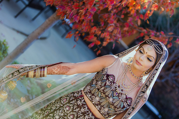 Elegant bride posing for a wedding portrait at The Meritage Resort and Spa in Napa surrounded by soft vineyard-inspired light