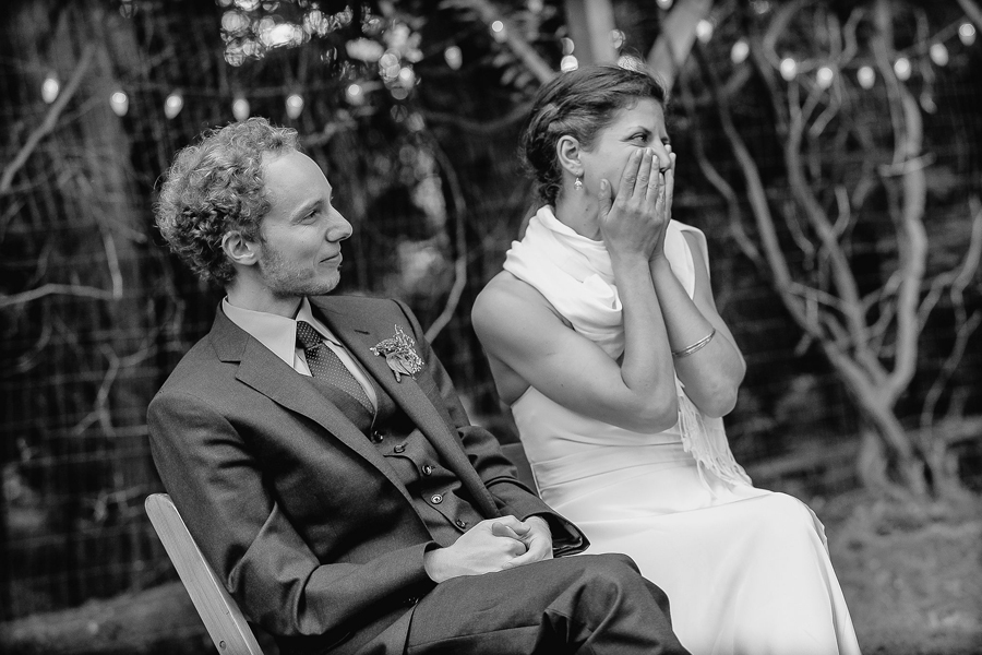 bride and groom reacting with laughter during a wedding reception speech at Ralston White Retreat in mill valley, California