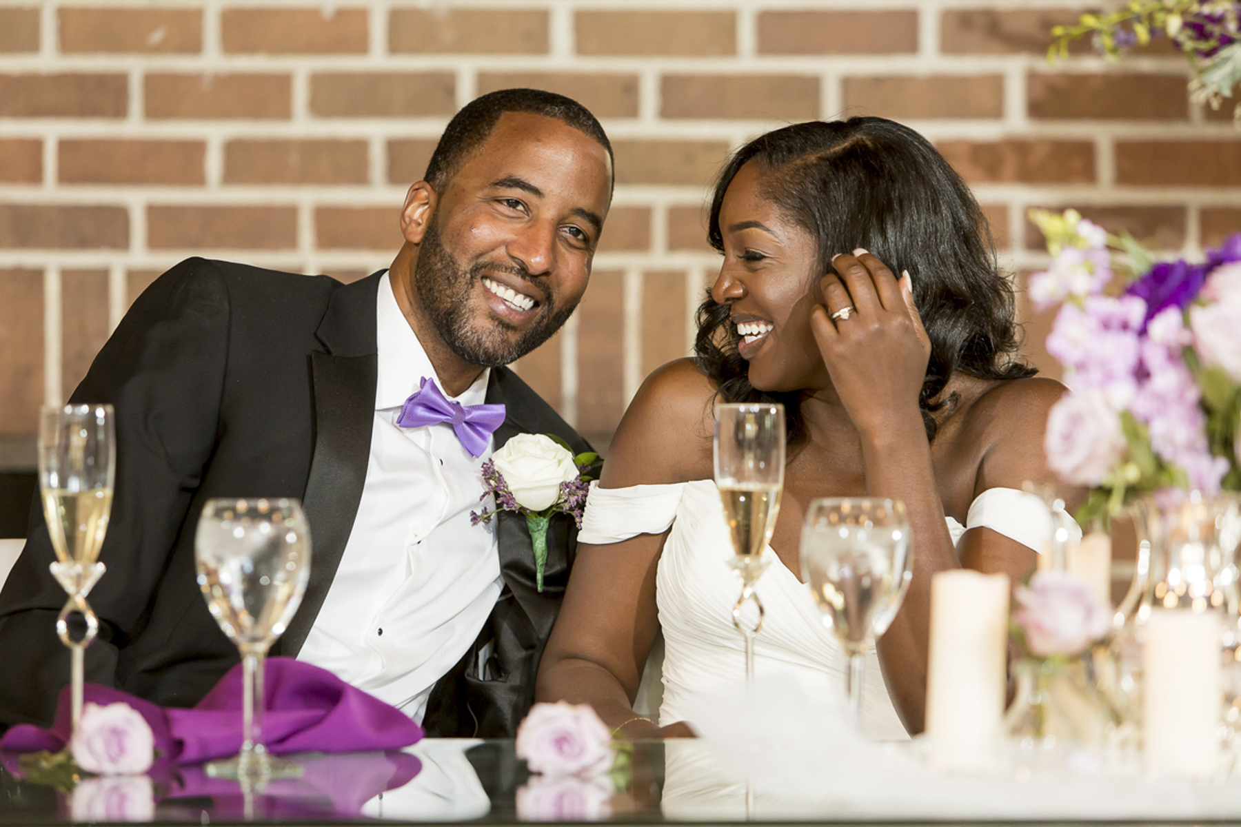 wedding couple laughing during a heartfelt reception speech at The University Club in San Francisco, California