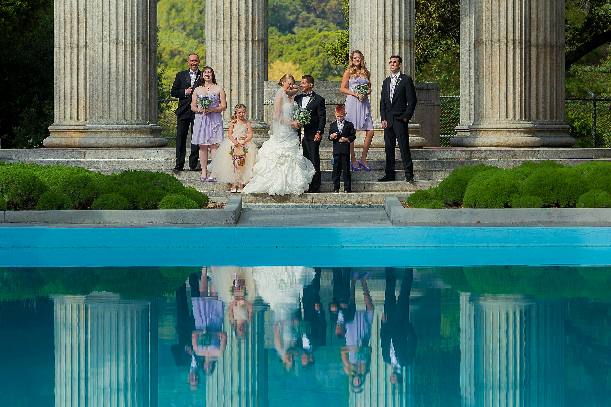 wedding party posing at the columns with water reflection at pulgas water temple in redwood city california