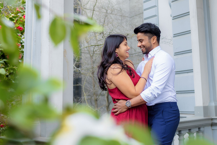 engaged indian couple posing for a romantic engagement portrait at crooker art museum in sacramento california