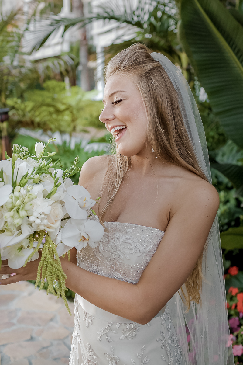 stunning and fun bride posing for a romantic wedding portrait at Fairmont Sonoma Mission Inn & Spa in Sonoma, California