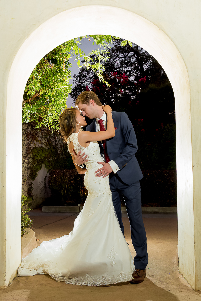 Bride and groom sharing a romantic portrait at Catta Verdera Country Club during their wedding.