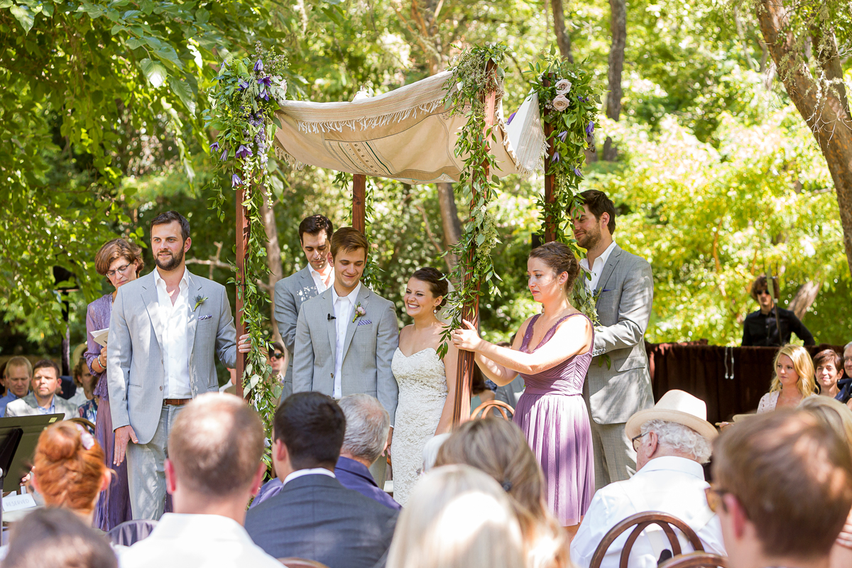 bride and groom outdoor wedding moment during their ceremony at Dawn Ranch in Guerneville, California