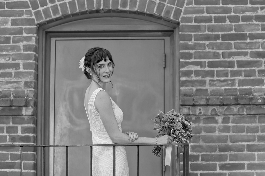 stunning bride posing for a wedding portrait at Woodland Hotel in Woodland, California