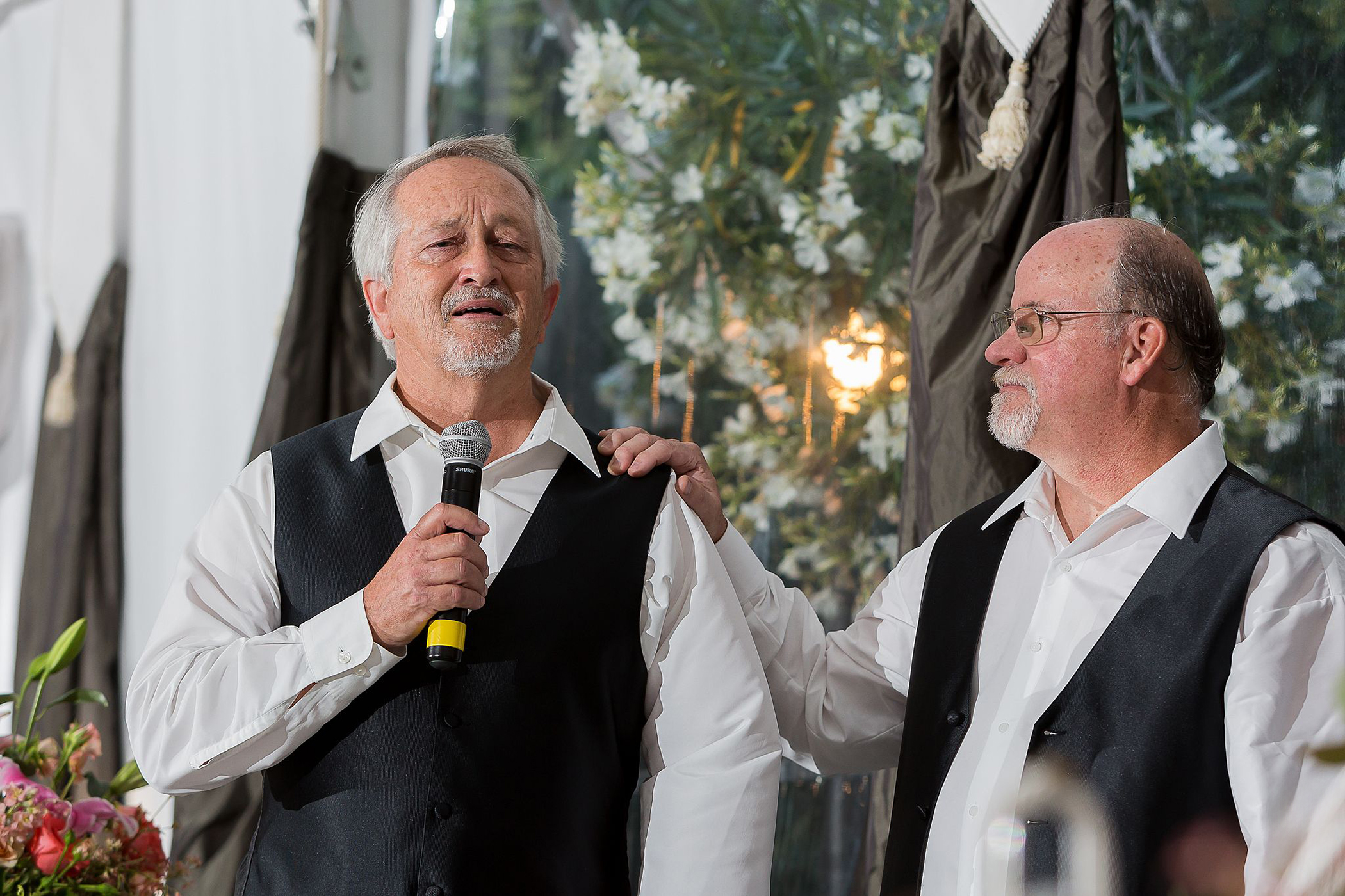 two fathers giving an emotional wedding speech and crying during the reception at Jefferson Street Mansion in Benicia, California
