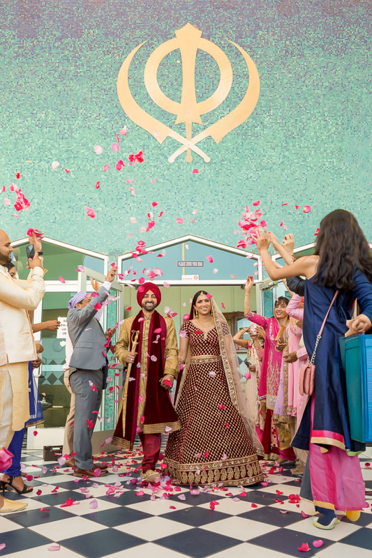 Indian bride and groom sharing meaningful moment during wedding ceremony in Yuba City California