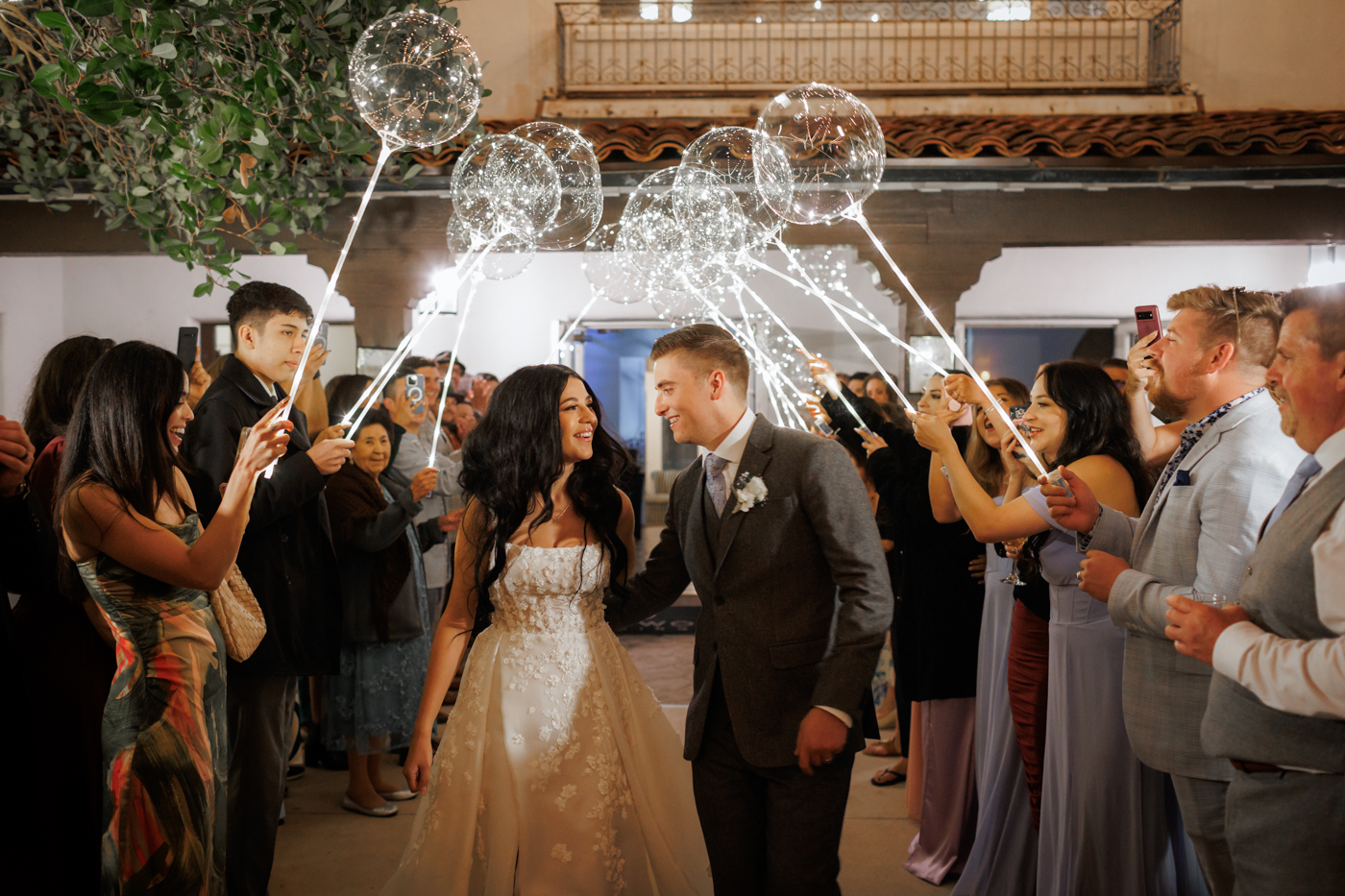 bride and groom celebrating their sparkler exit at Hacienda de la Flores in Lafayette, California surrounded by cheering guests