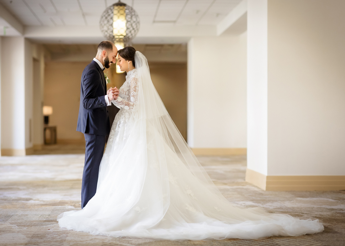 Bride and groom sharing a quiet moment together at the San Ramon Marriott during their wedding day