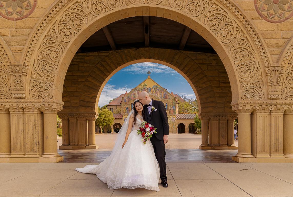 bride and groom sharing a romantic moment during their wedding at Stanford University in Stanford, California