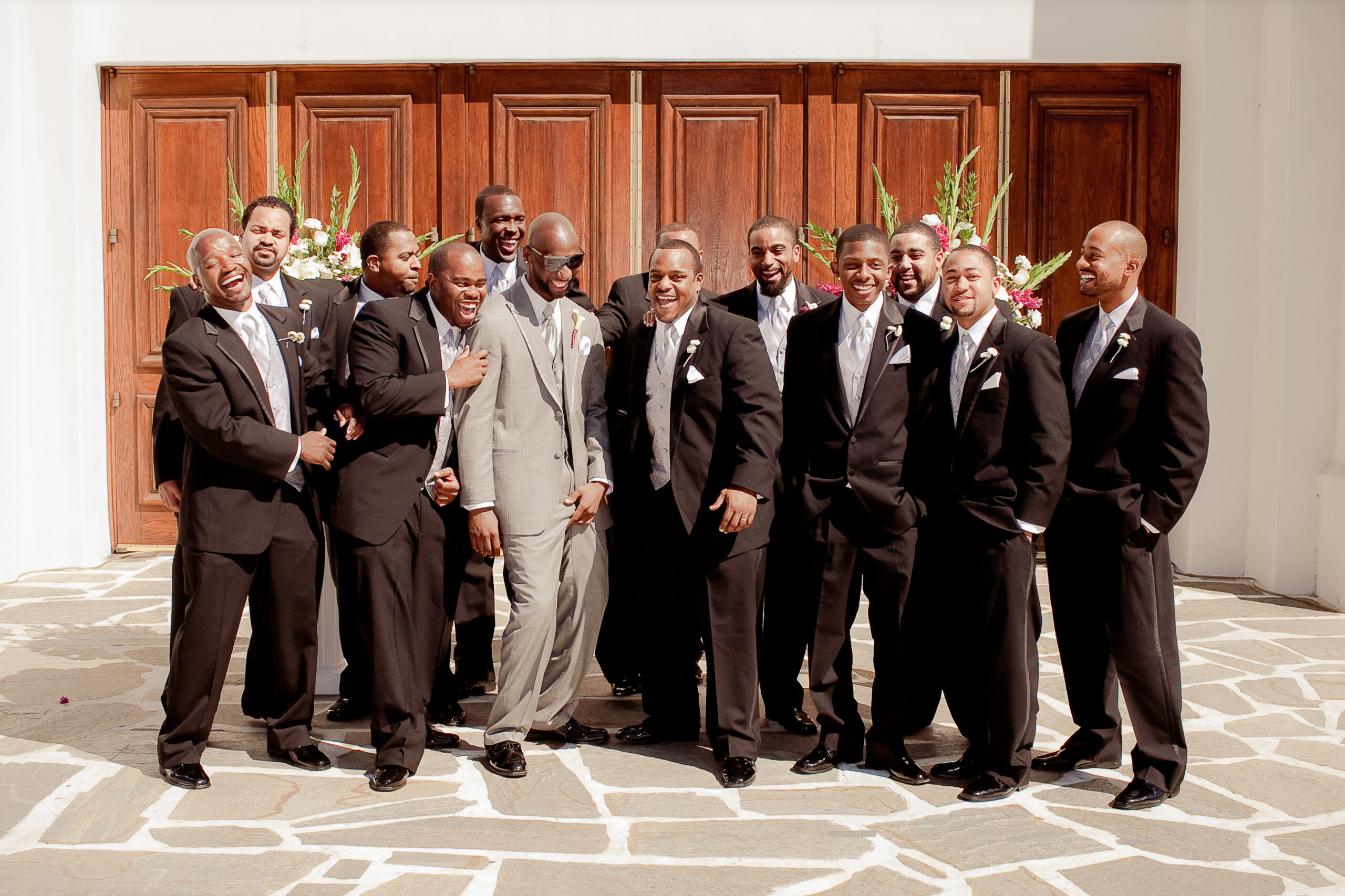 playful and stylish wedding photo of groom with groomsmen at Sacramento Masonic Temple, California