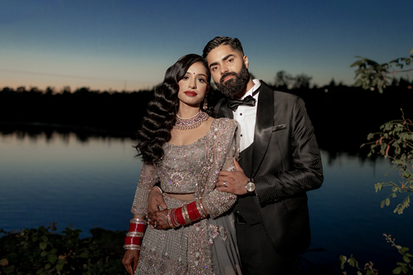Romantic sunset portrait of bride and groom by the waterfront at Hyatt Regency San Francisco Airport Waterfront in South SF