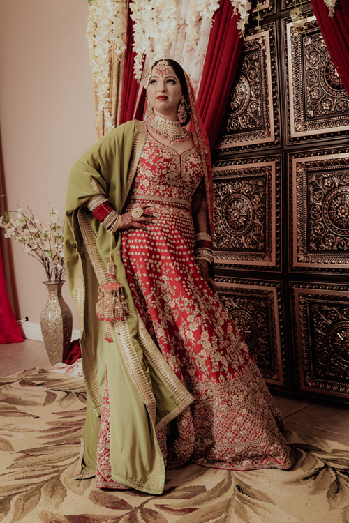 Beautiful Sikh bride preparing at home in traditional attire before her wedding day at West Sacramento Gurdwara