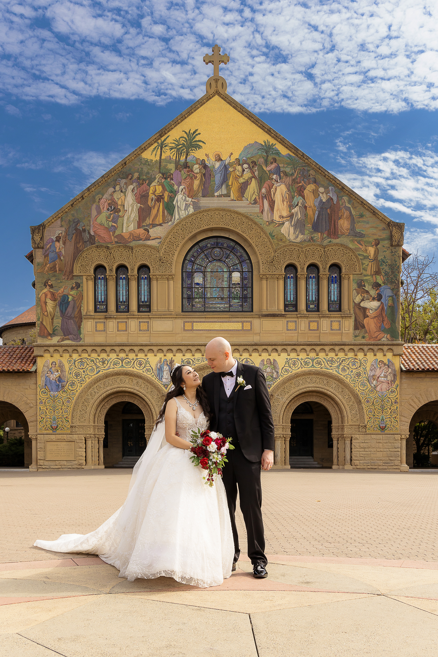 Bride and groom portrait in front of Stanford Memorial Church in Palo Alto