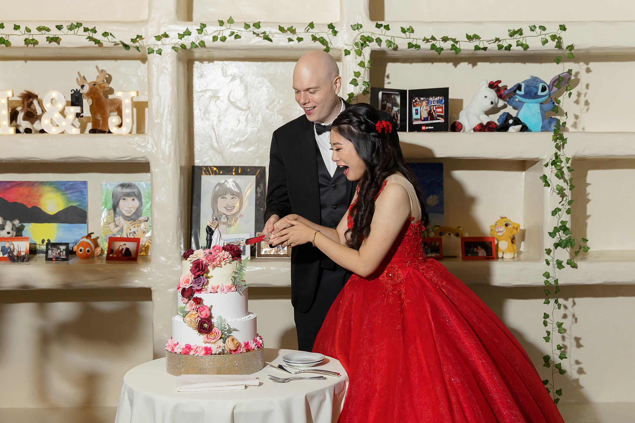 Bride and groom cutting wedding cake at Allied Arts Guild in Menlo Park