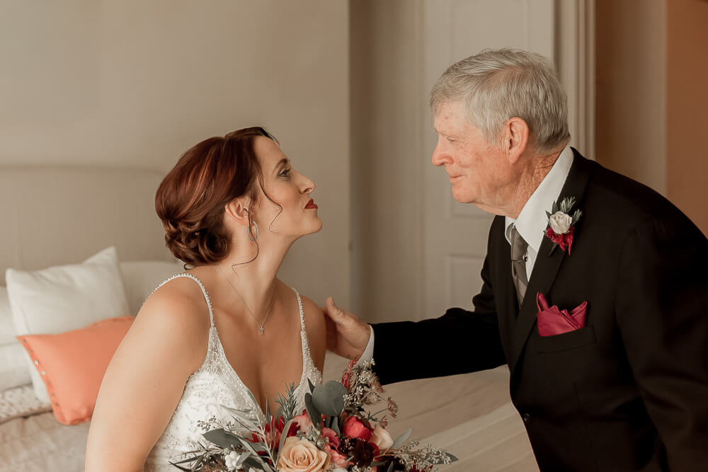Emotional father seeing his daughter for the first time before wedding ceremony at Hyatt Regency Sacramento hotel