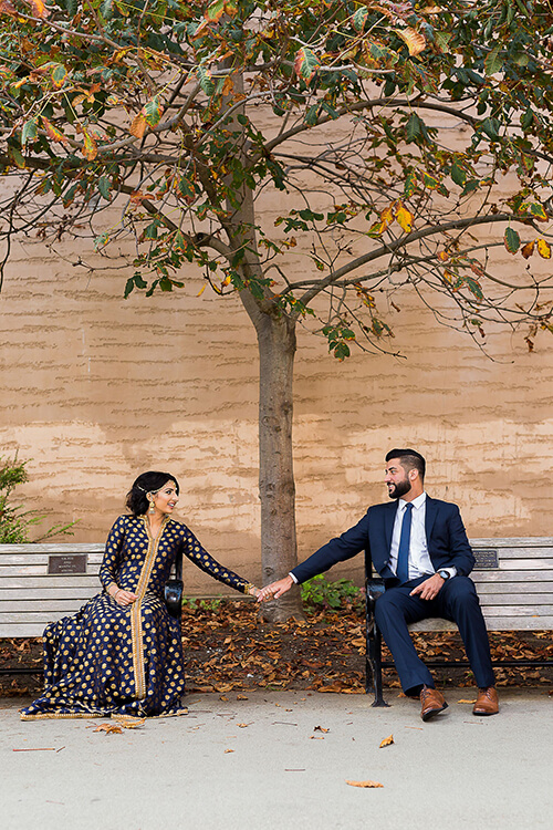 Couple holding hands on bench at Palace of Fine Arts San Francisco, quiet romantic moment with soft natural light