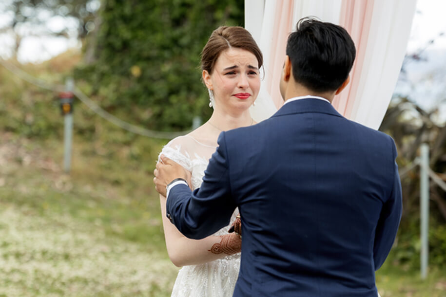 Emotional bride standing at the ceremony altar at the General’s Residence wedding venue in San Francisco