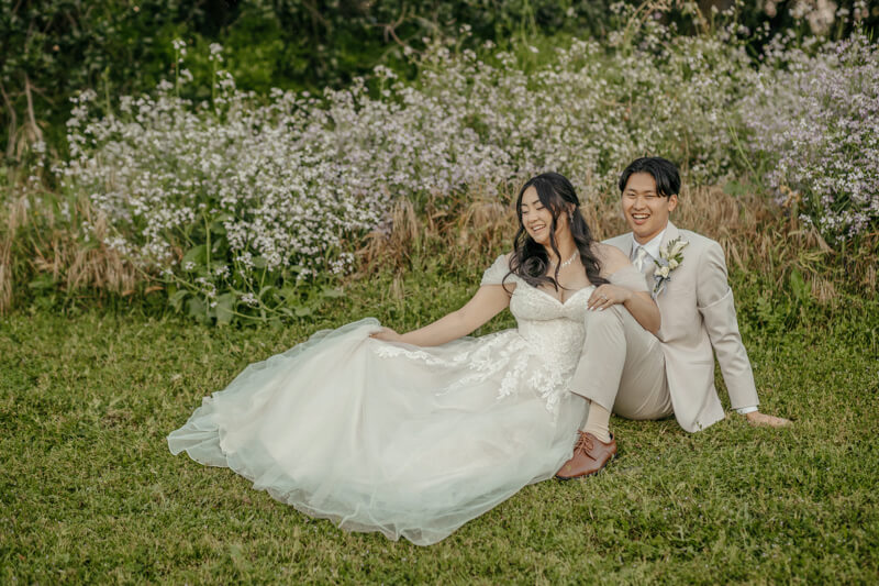 Candid bride and groom portrait on the lawn at Haggin Oaks Golf Complex in Sacramento