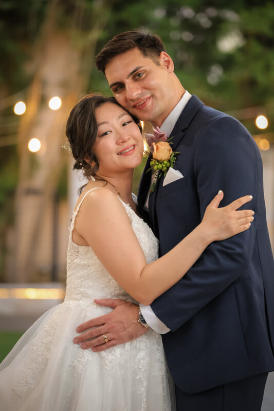 : Dramatic nighttime portrait of the bride and groom at Brownstone Gardens in Oakley, Ca