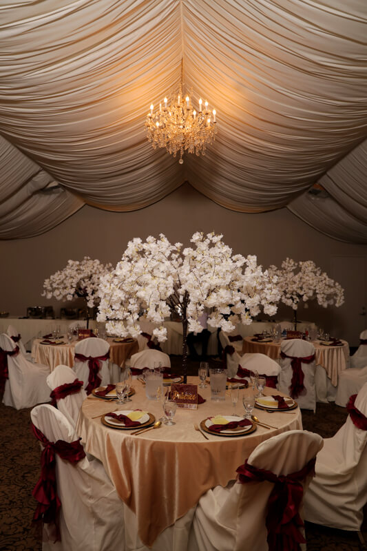 Beautiful indoor wedding reception table at Grand Island Mansion with elegant floral decor