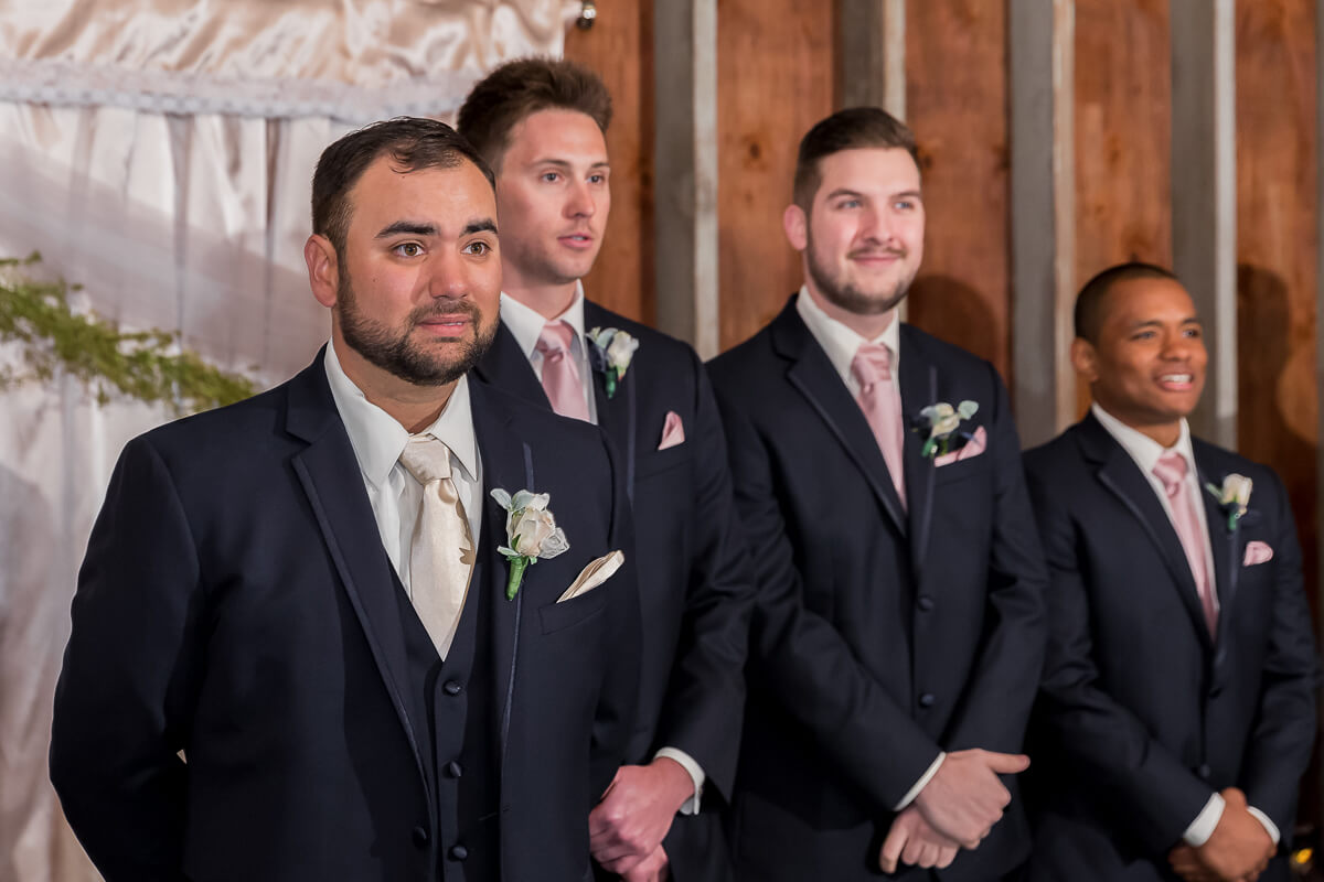 Emotional groom seeing his bride for the first time at The Barns at Cooper Molera.